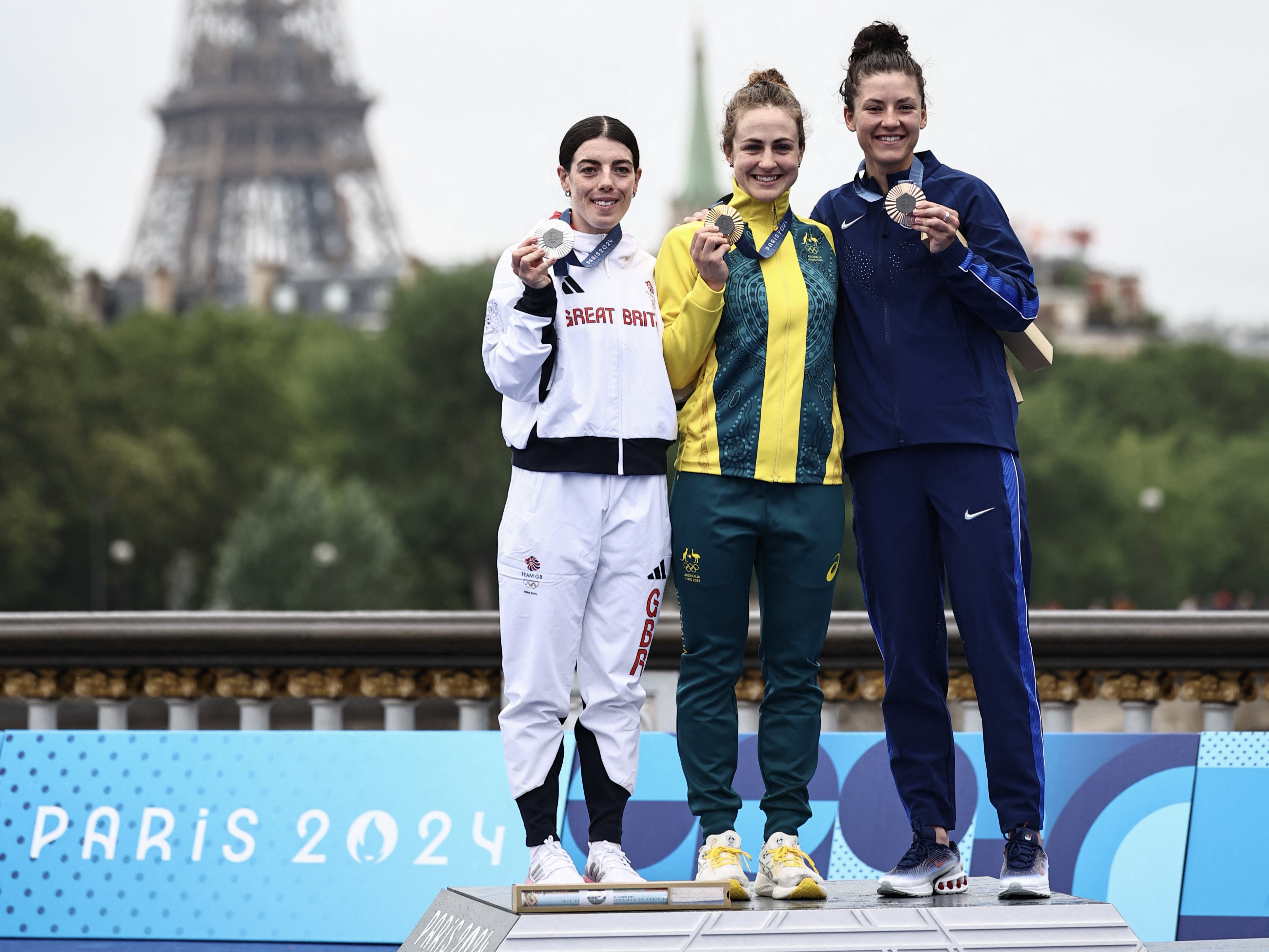 Australian cyclist Grace Brown with Anna Henderson and Chloe Dygert on the podium of the Paris 2024 Olympic Games women's road individual time trial